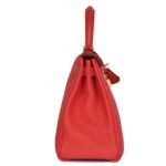 PRE-OWNED HERMÈS KELLY RETOURNE 28 ROUGE PIVOINE TOGO GOLD HARDWARE