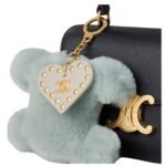 CELINE TRIOMPHE POM POM KEYRING WITH HEART IN SHEARLING AND CALFSKIN WITH GOLD FINISHING LIGHT CLAY